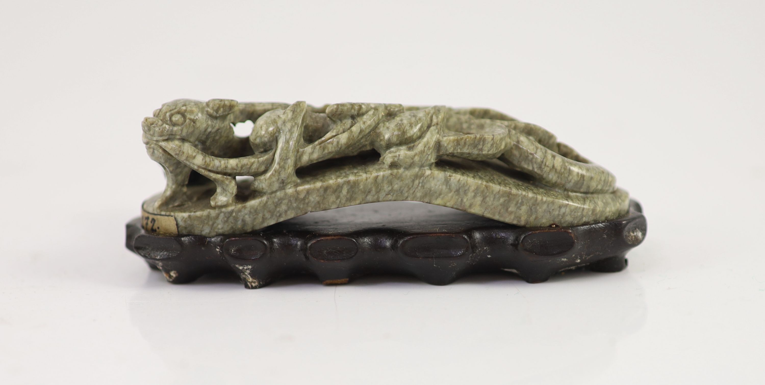 A Chinese ‘chicken bone’ jade carving, 17th/18th century 11 cm long including wood stand